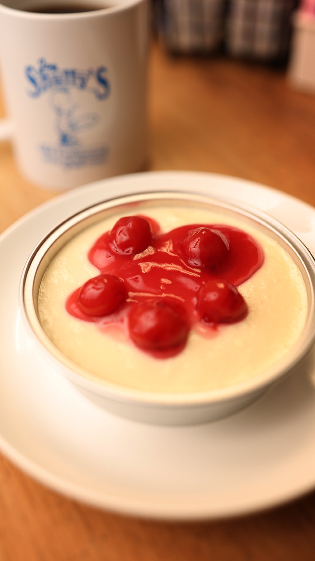 Dessert topped with whipped cream and sauce