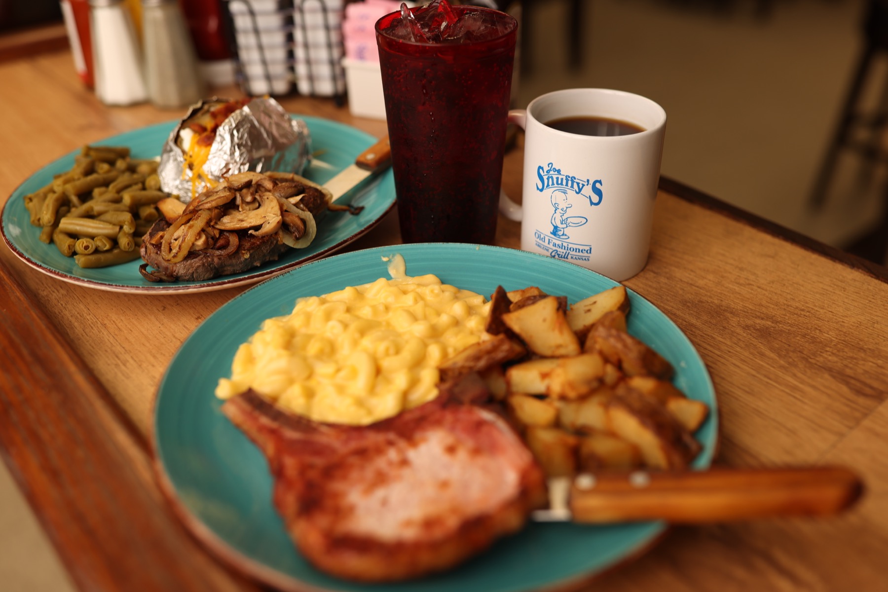 Full plates of food and a Joe Snuffy's mug