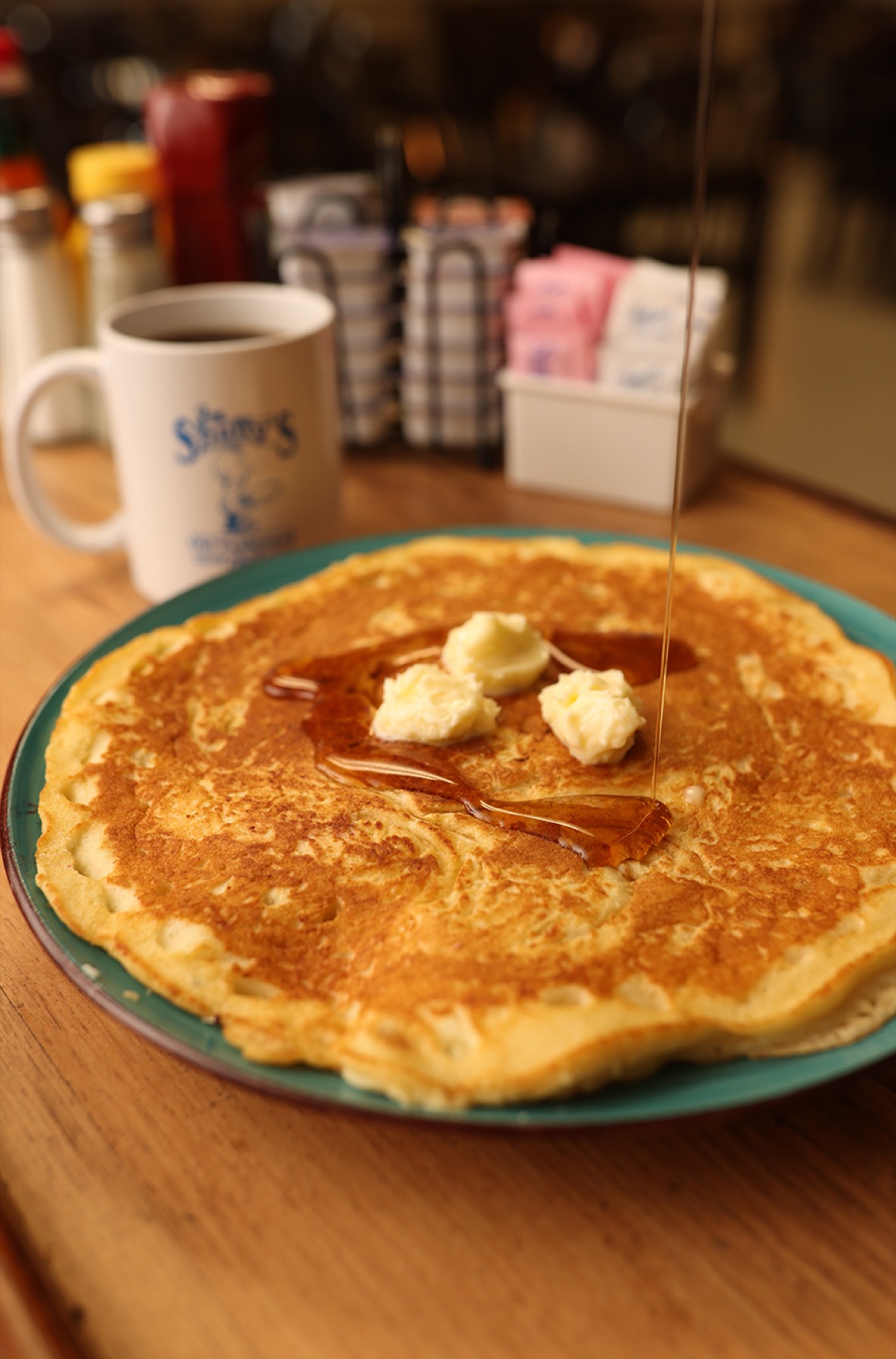 Large pancake with butter and syrup