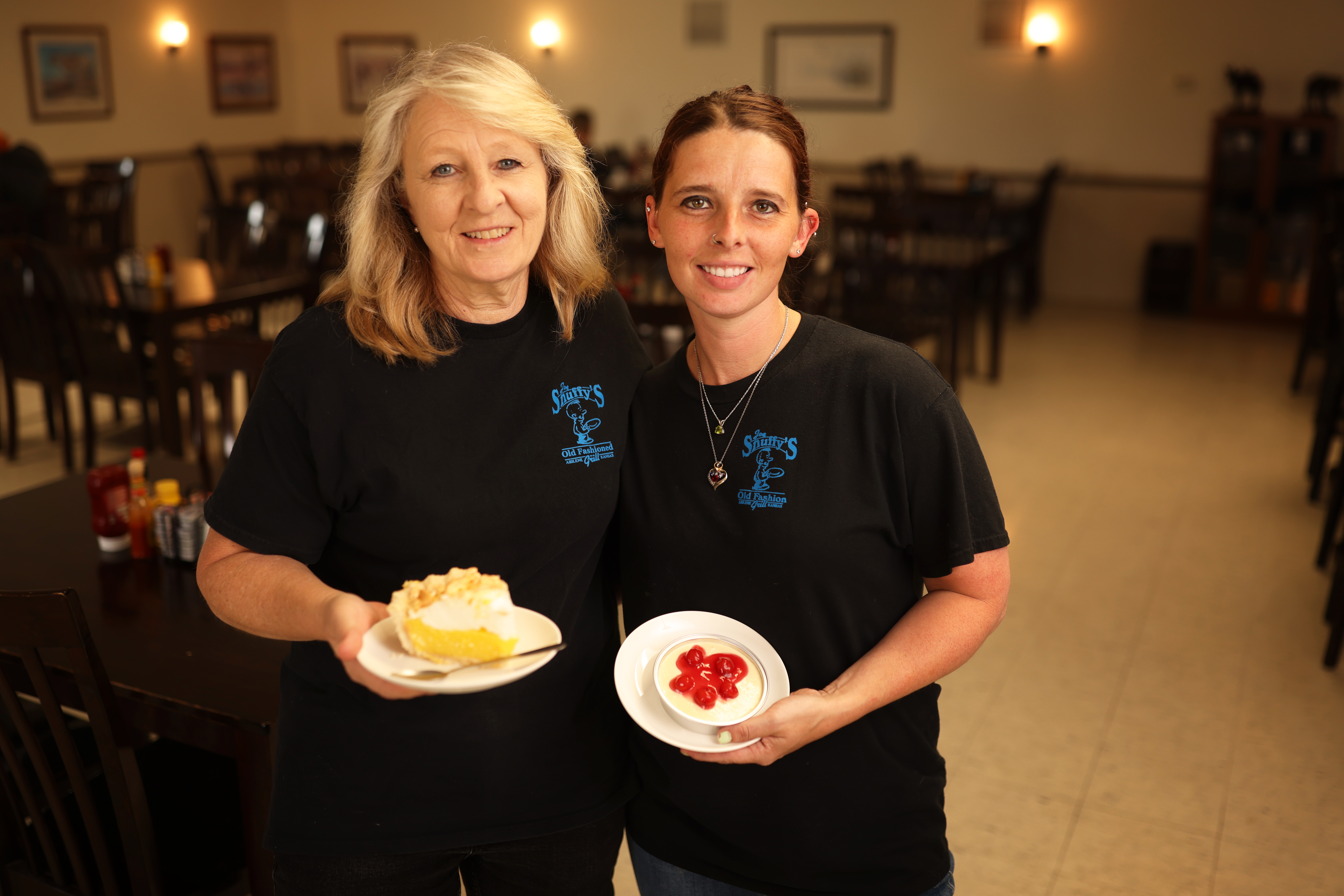 Joe Snuffy's staff smiling inside the restaurant